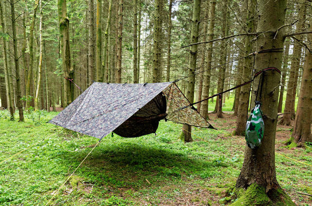 tarps camping to be covered from rain in forest