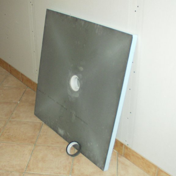 Contoured walk-in shower tray for a wet room