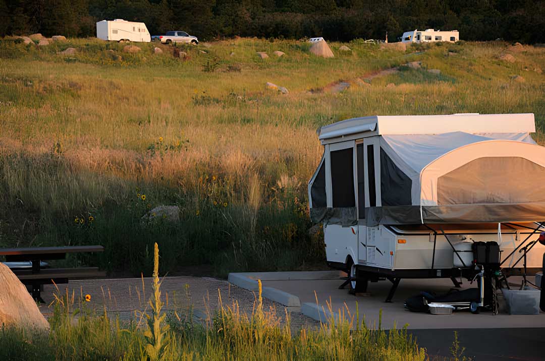parked and level pop up camper on concrete rv camp
