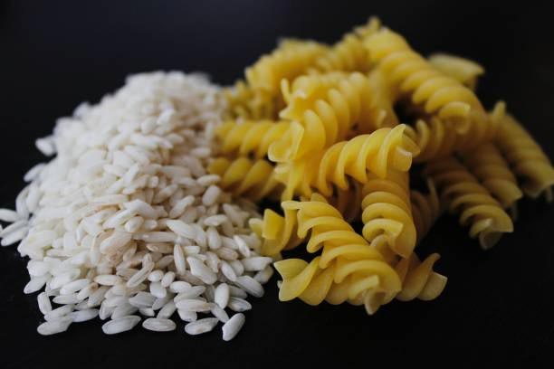 rice and pasta on a dark background
