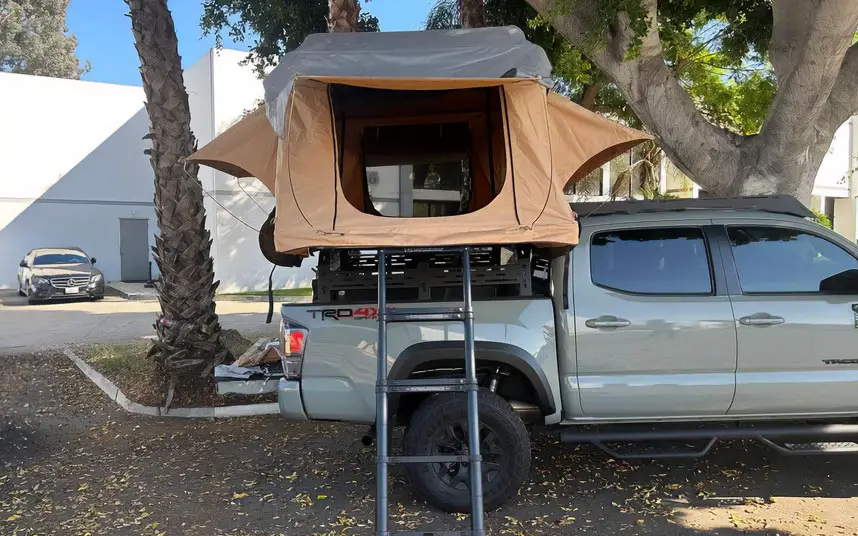 beige roof tent on a pickup 4x4