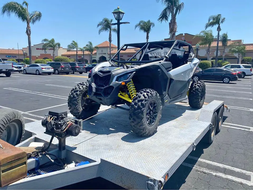 utv on a trailer in a parking